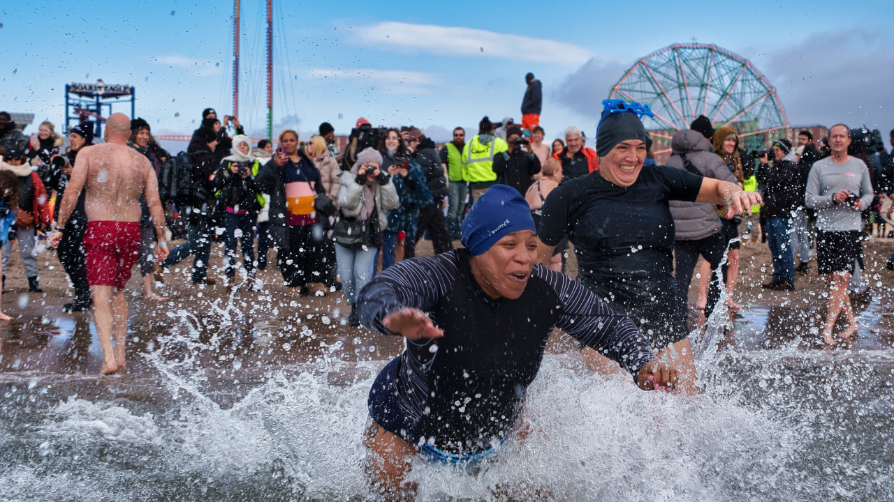 Brave swimmers Coney Island Polar Bear Plunge, diving into icy Atlantic waters for charity