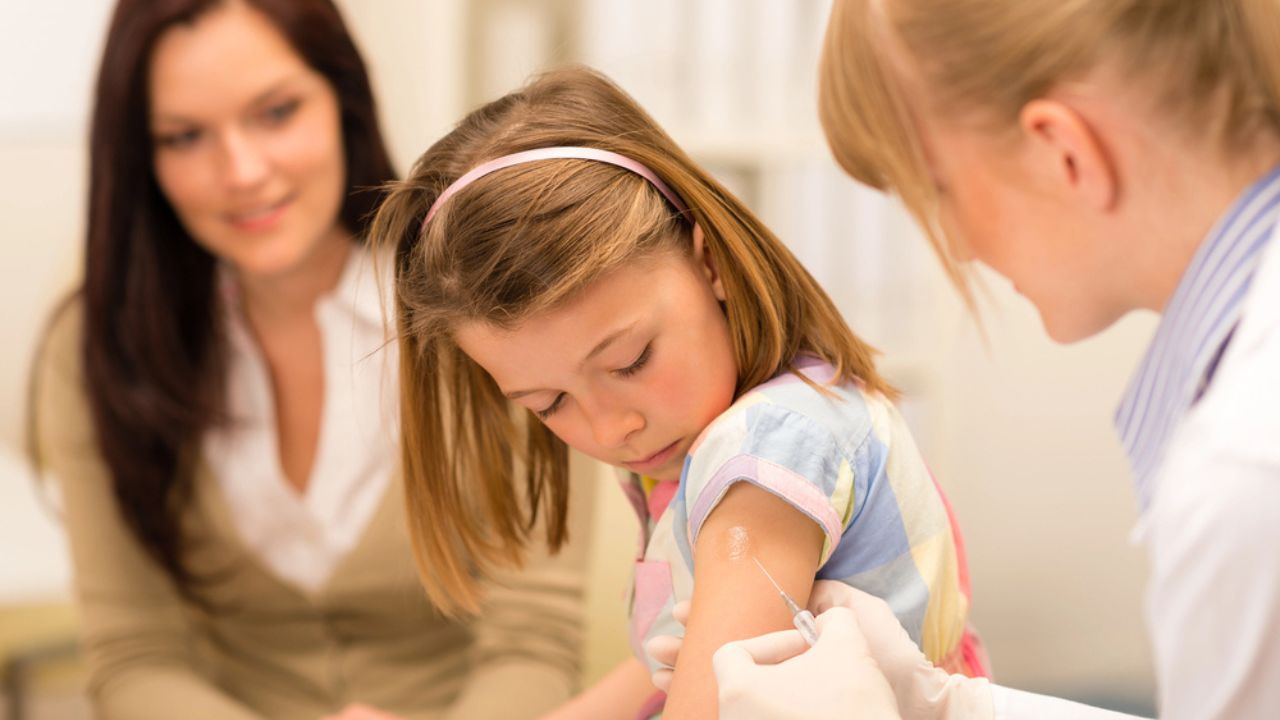 Child vaccination pediatrician apply injection