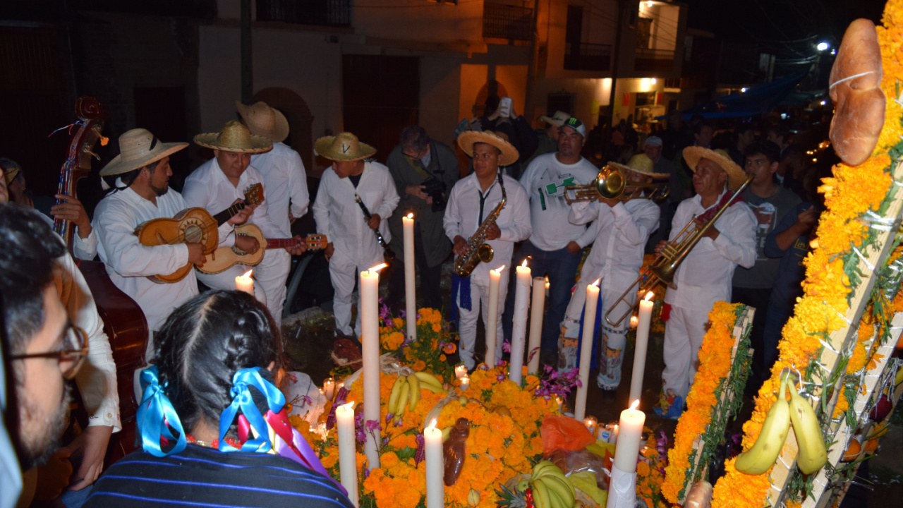 Day of the dead celebration at the local cemetery where people spend the night with their dead