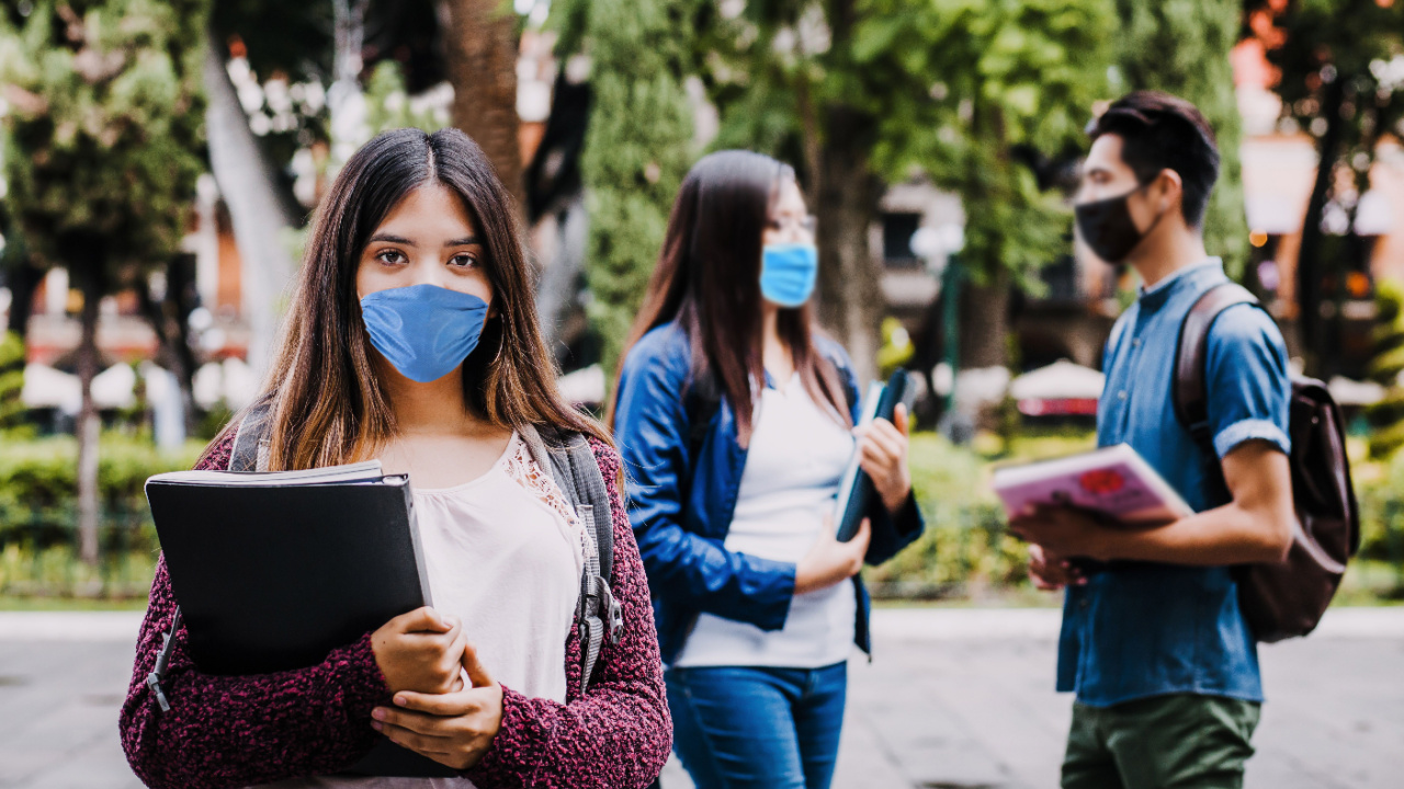 Girl student wearing mask face to prevent flu infection or respiratory illness, protection against contagious virus