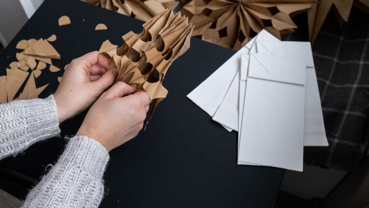 Making craft paper snowflakes for Christmas decor, DIY paper star medallion